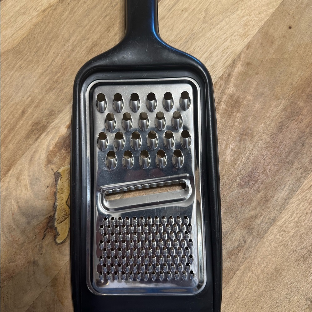Sleek Black and Silver Handheld Grater